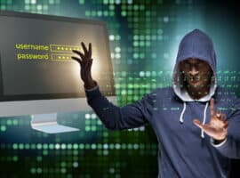 Hooded hacker in data computer security concept